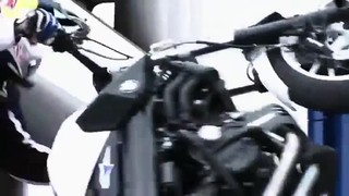 Chris Pfeiffer stunt rides through the BMW Tower