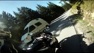 Motorcycling on serpentine with 2 persons and released wheel